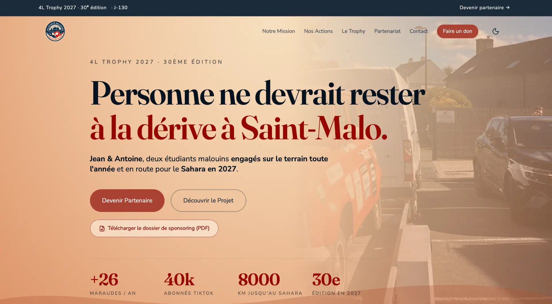 Page d'accueil du site Solidarité Malouine : titre « Personne ne devrait rester à la dérive à Saint-Malo. » et bouton Devenir partenaire